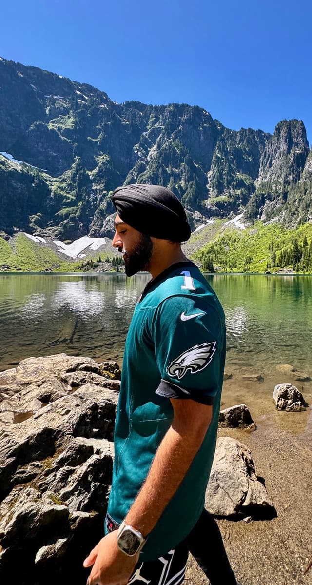 Gursimran Singh outdoors at an alpine lake